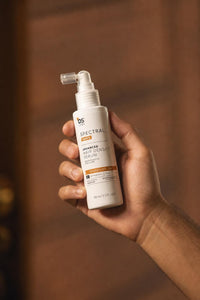 Spectral Men's Advanced Hair Density Serum — sostenido en mano